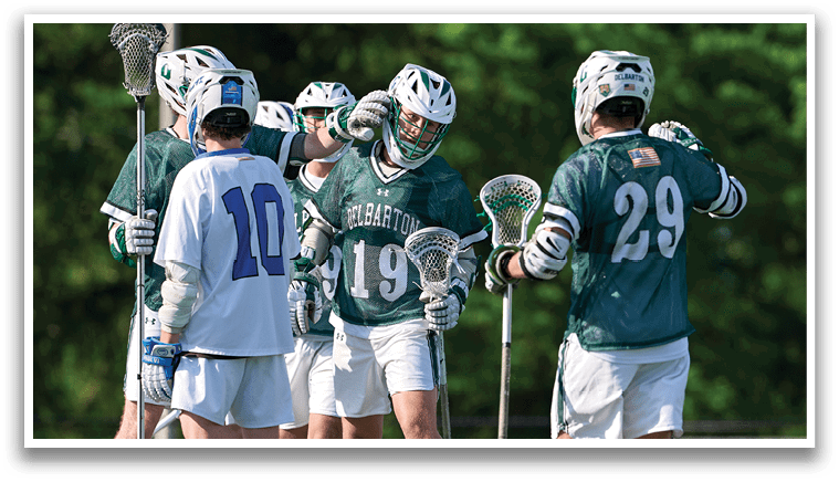 A group of men wearing green and white uniforms. Description generated by AI
