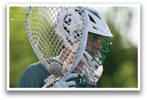 A man holding a baseball bat with a net on the end. Description generated by AI