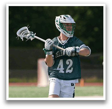 A man wearing a green and white jersey with the number 42 on it. Description generated by AI