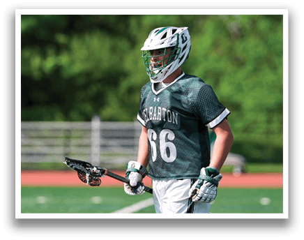 A man wearing a green and white jersey with the number 6 on it. Description generated by AI