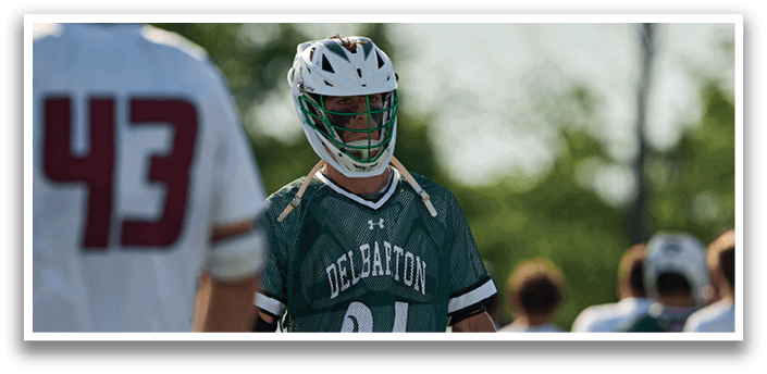 A man wearing a green and white jersey with the number 35 on it. Description generated by AI