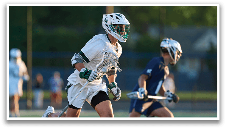 A group of men wearing green and white uniforms. Description generated by AI