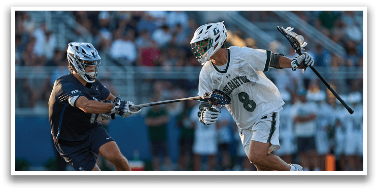 A man wearing a green and white uniform is running on a field. Description generated by AI