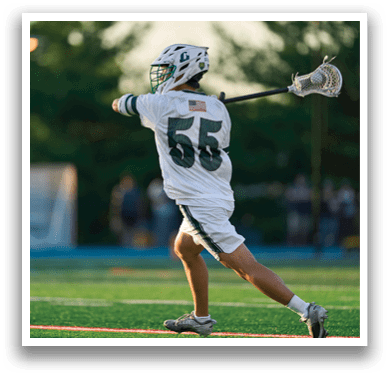 A man holding a lacrosse net. Description generated by AI