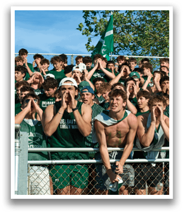 A man wearing a green and white jersey. Description generated by AI