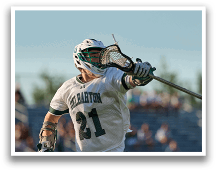 A man wearing a green and white jersey. Description generated by AI