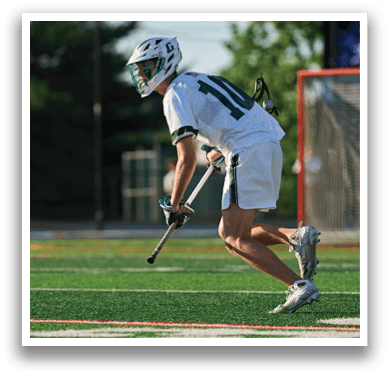 A man wearing a green and white helmet. Description generated by AI