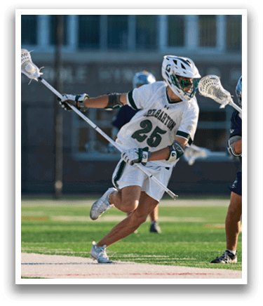 A man wearing a green and white shirt and white shorts is running on a field. Description generated by AI