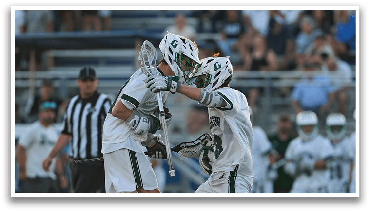 A group of men wearing green and white uniforms. Description generated by AI
