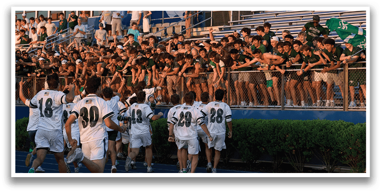 A man wearing a green and white uniform is running on a field. Description generated by AI