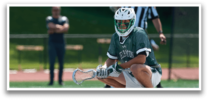 A man with a green and white jersey is holding a catcher's mitt. Description generated by AI