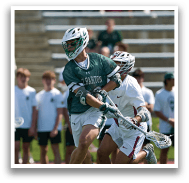 A man wearing a green and white helmet. Description generated by AI