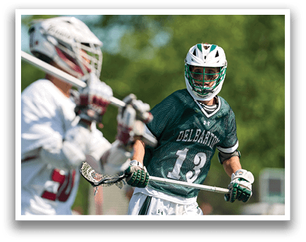 A man wearing a green and white jersey with the number 6 on it. Description generated by AI
