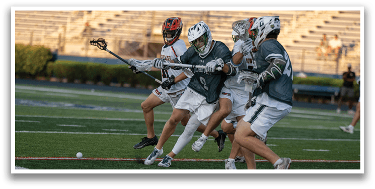 A man wearing a green and white uniform is running on a field. Description generated by AI