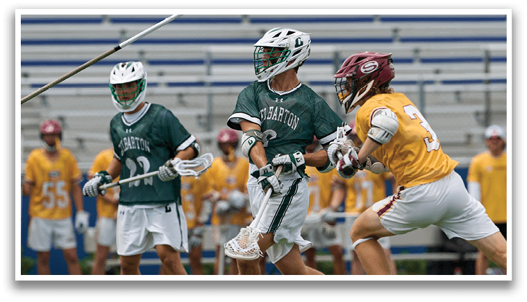 A group of men wearing green and white uniforms. Description generated by AI