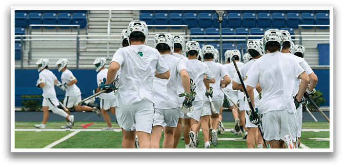 Two men playing a game of lacrosse. Description generated by AI