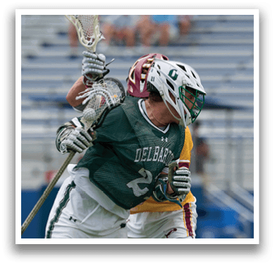 A man wearing a green and white jersey with the number 42 on it. Description generated by AI