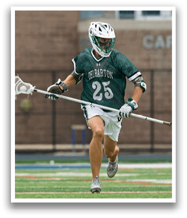 A man wearing a green and white shirt and white shorts is running on a field. Description generated by AI