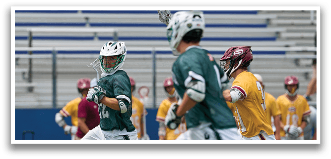 A man in a green shirt and white shorts is running with a lacrosse stick. Description generated by AI