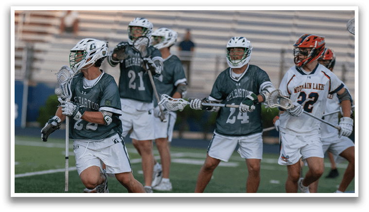 A group of men wearing green and white uniforms. Description generated by AI