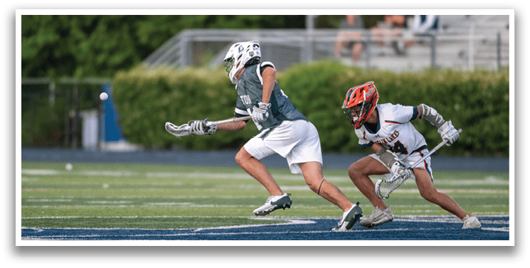 A man wearing a green and white uniform is running on a field. Description generated by AI
