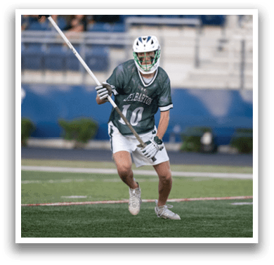 A man holding a lacrosse net. Description generated by AI