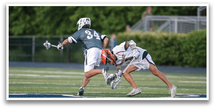 A man wearing a green and white uniform is running on a field. Description generated by AI