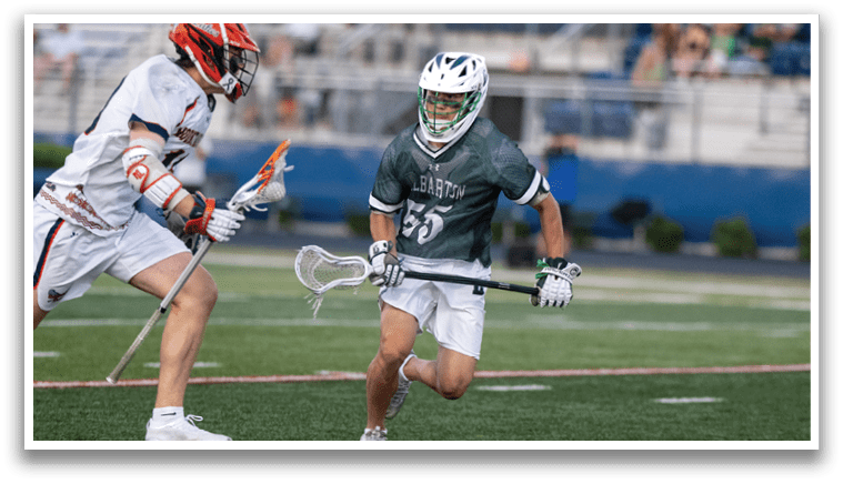 A group of men wearing green and white uniforms. Description generated by AI
