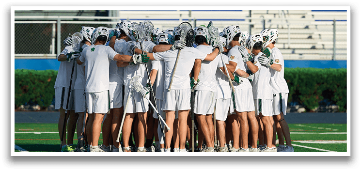 A group of young men wearing green and white uniforms. Description generated by AI