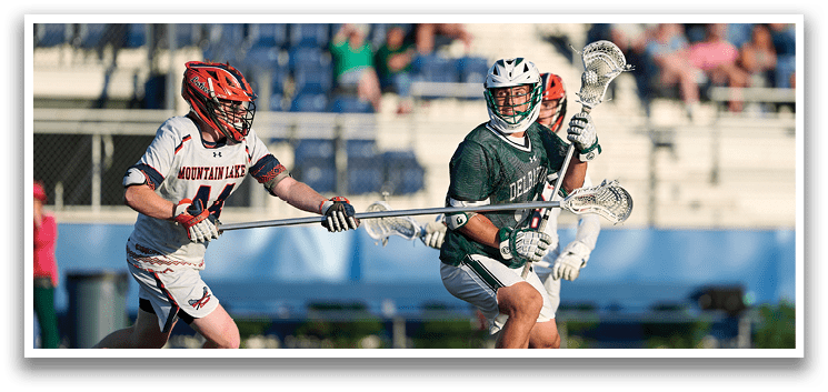 A group of young men wearing green and white uniforms. Description generated by AI