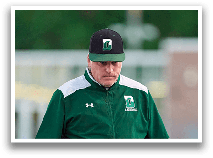 A man wearing a green jacket with a hood on his head. Description generated by AI