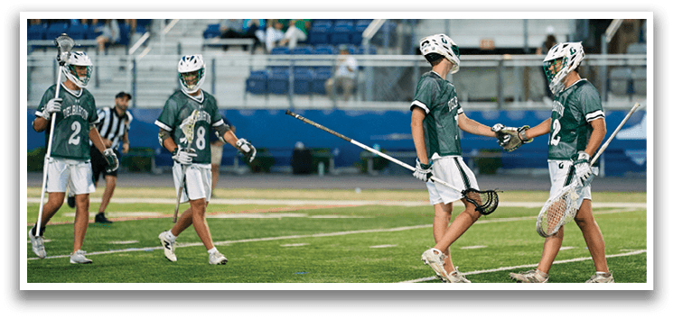 A group of young men wearing green and white uniforms. Description generated by AI