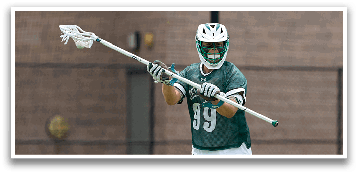 A man wearing a green and white jersey is running on a field. Description generated by AI
