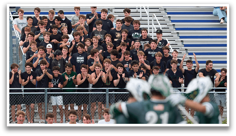 A group of men wearing green and white uniforms. Description generated by AI