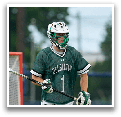 A man holding a lacrosse net. Description generated by AI