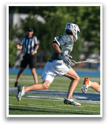 A man wearing a green and white jersey. Description generated by AI