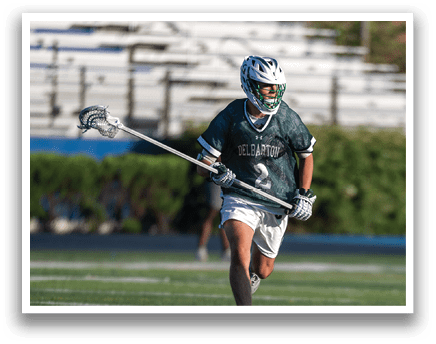 A man wearing a green and white jersey. Description generated by AI