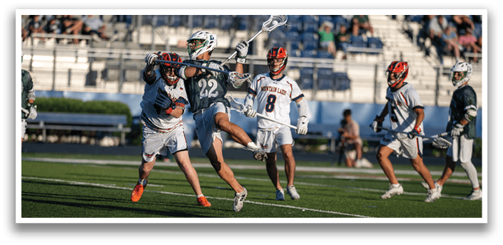 A man in a green shirt and white shorts is running with a lacrosse stick. Description generated by AI