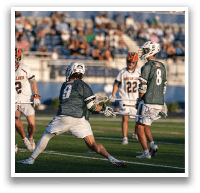 A man wearing a green and white jersey with the number 42 on it. Description generated by AI