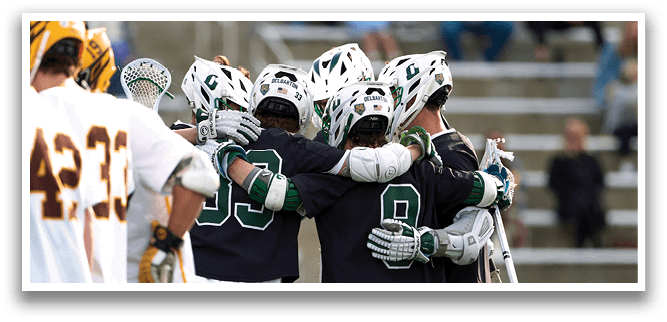 A group of men wearing white and black uniforms. Description generated by AI