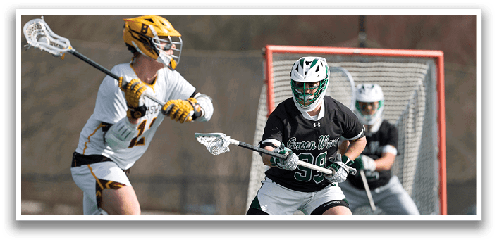 A man in a white uniform is holding a lacrosse stick. Description generated by AI