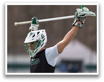 A man wearing a black and white shirt and a green helmet. Description generated by AI