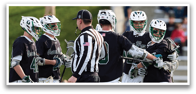 A group of lacrosse players on a field. Description generated by AI
