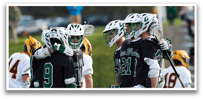 A group of lacrosse players hugging each other. Description generated by AI