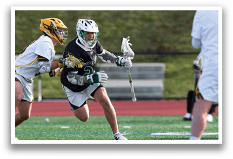 A group of people playing a game of lacrosse. Description generated by AI