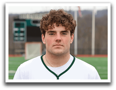 A man wearing a white and green Delaware shirt. Description generated by AI