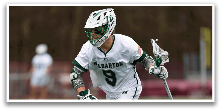 A man wearing a white and green uniform is running on a field. Description generated by AI