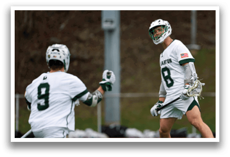 A man wearing a white jersey with the number 8 on it. Description generated by AI