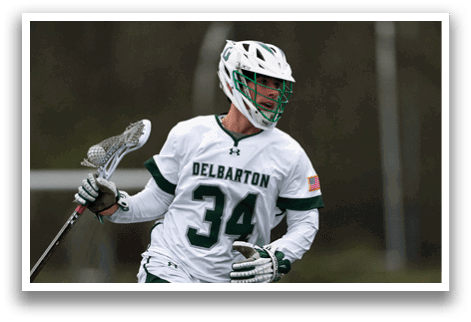 A man wearing a white and green jersey with the number 34 on it. Description generated by AI