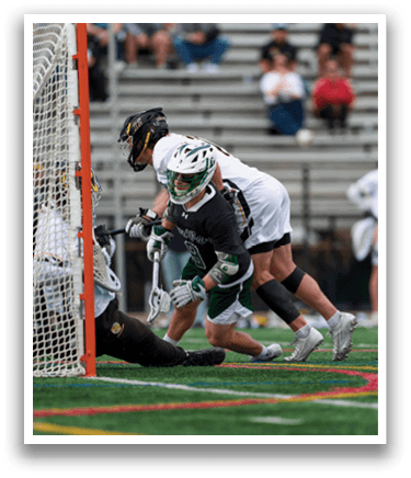 A man in a green and white uniform is sliding into a goal. Description generated by AI